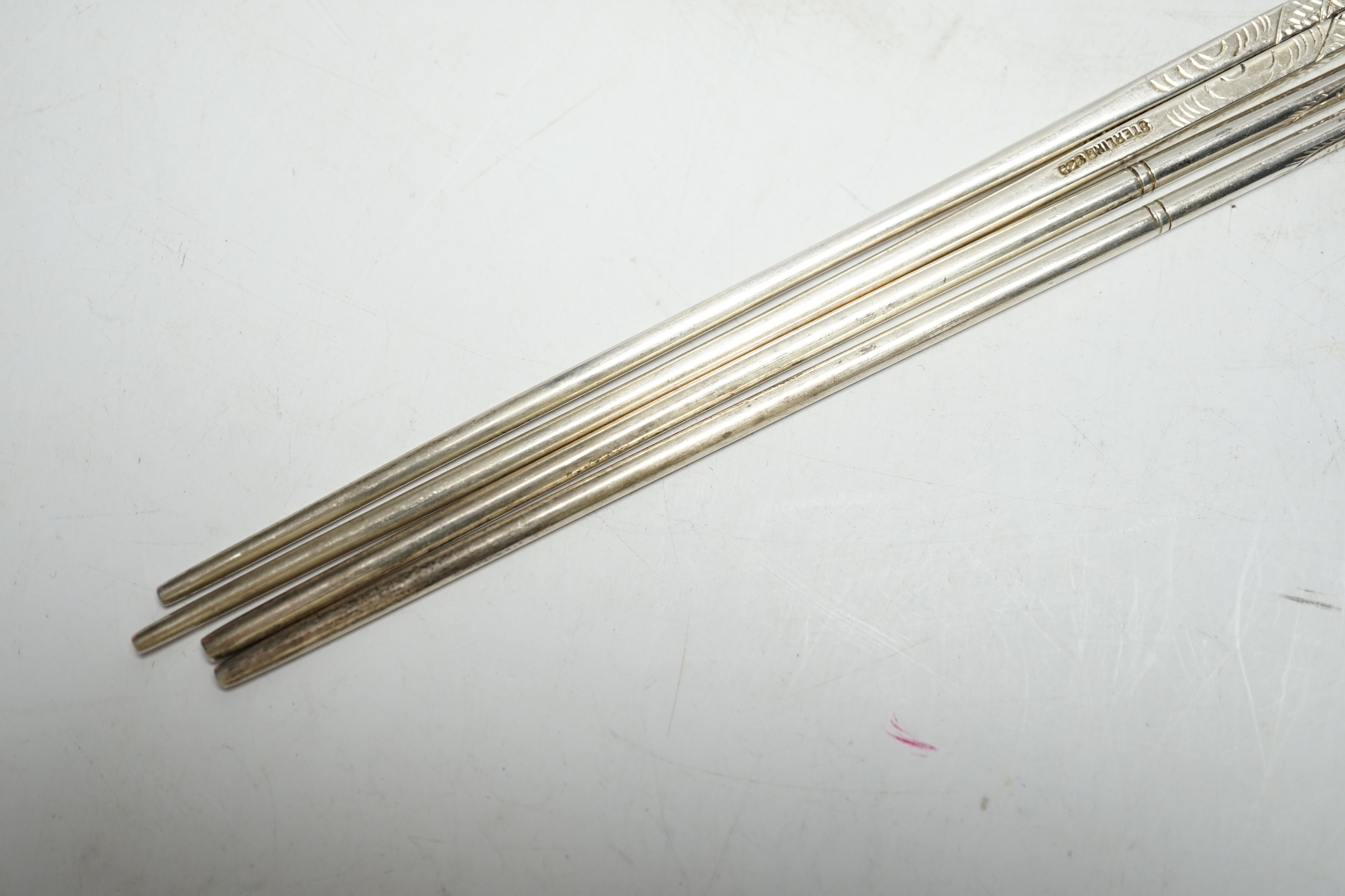 Two pairs of Chinese sterling chopsticks, approx. 23cm.